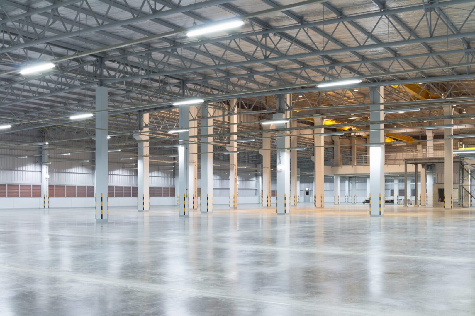 Empty factory building or warehouse building with concrete floor for industry background.